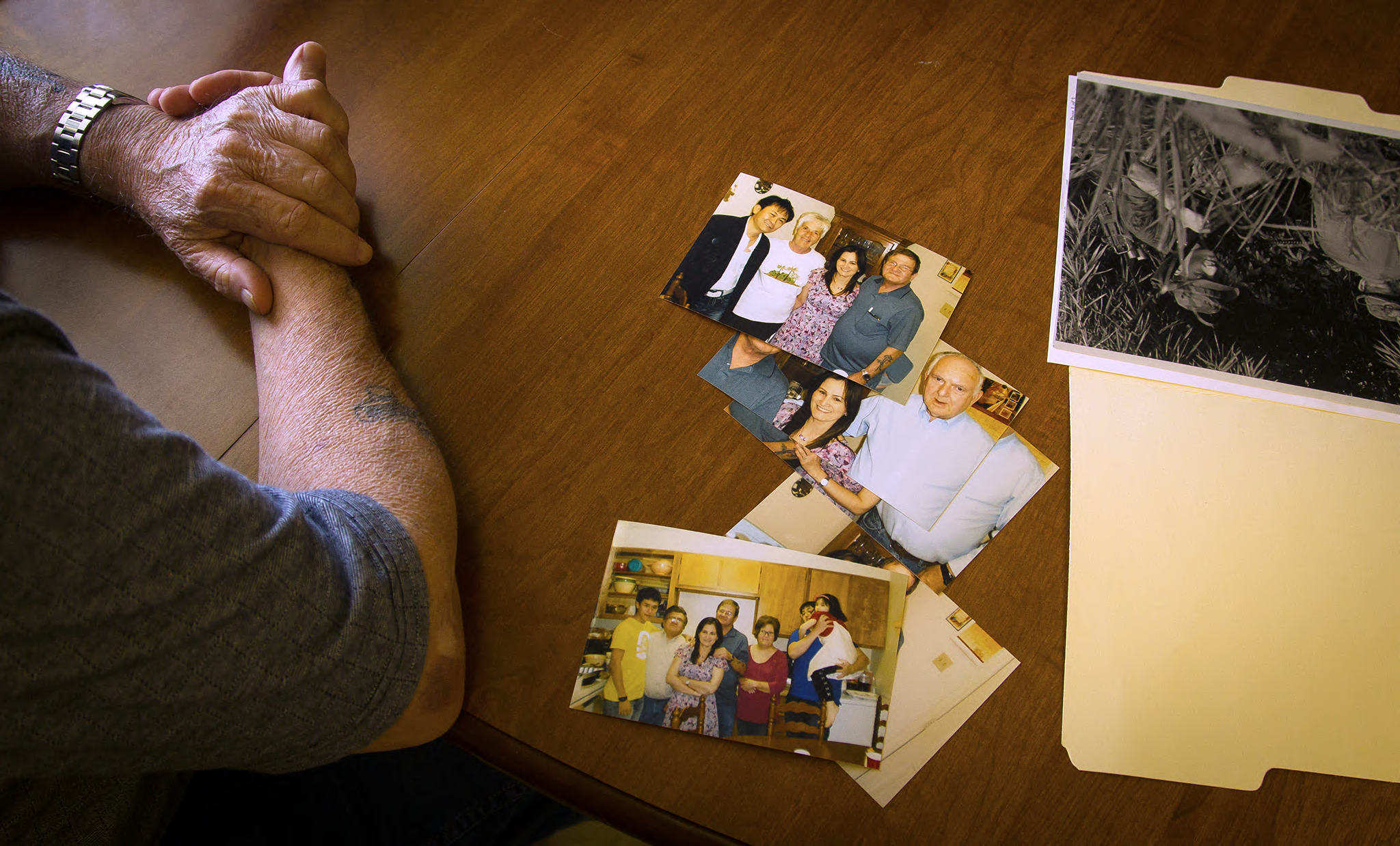 James Copeland, an American veteran who found a daughter, Tiffany Nguyen, born in Vietnam after he left, with photos of them together, in Corinth, Mississippi. August 15, 2013. (Lance Murphey/The New York Times)