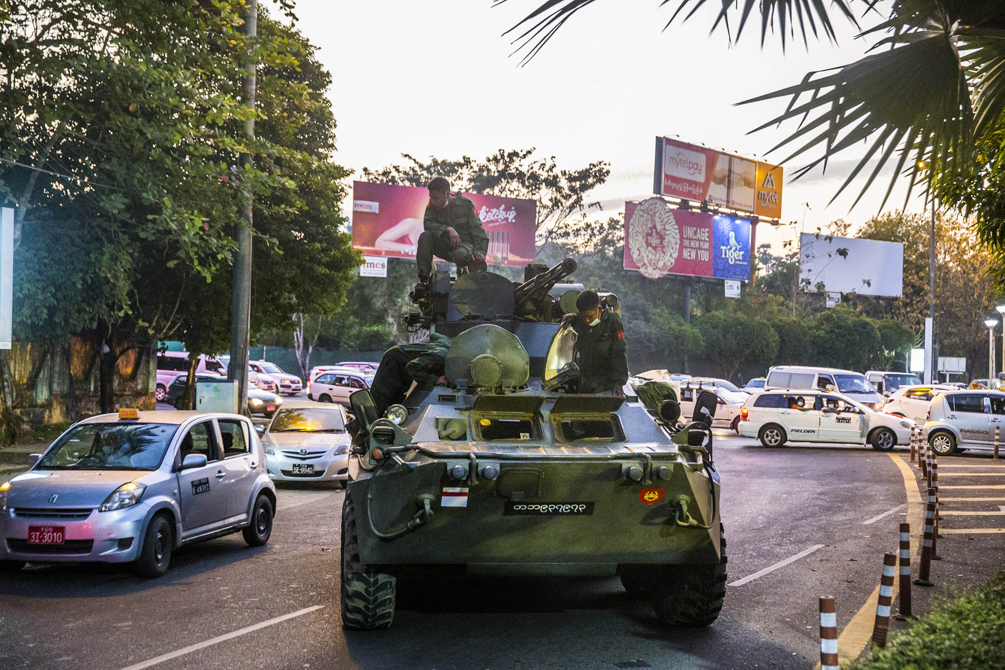 Soldiers sit atop an armored military vehicle in Yangon, Myanmar. February 14, 2021. (The New York Times)