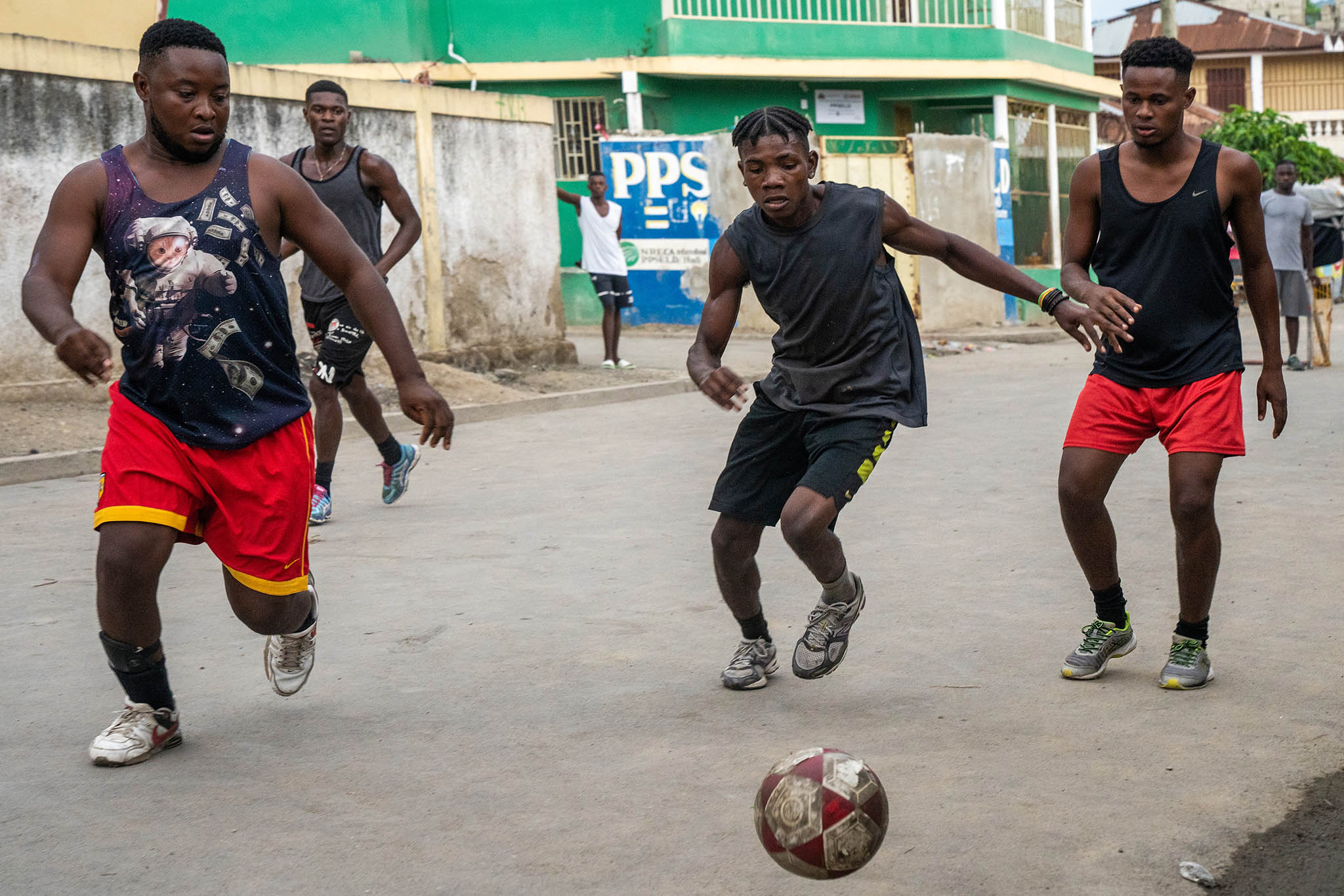People play soccer in the streets in Trou-du-Nord, Haiti, on July 15, 2021. Even as civil society has grown more diverse and dynamic, no political outlet has been developed to channel its energy. (Federico Rios/The New York Times)