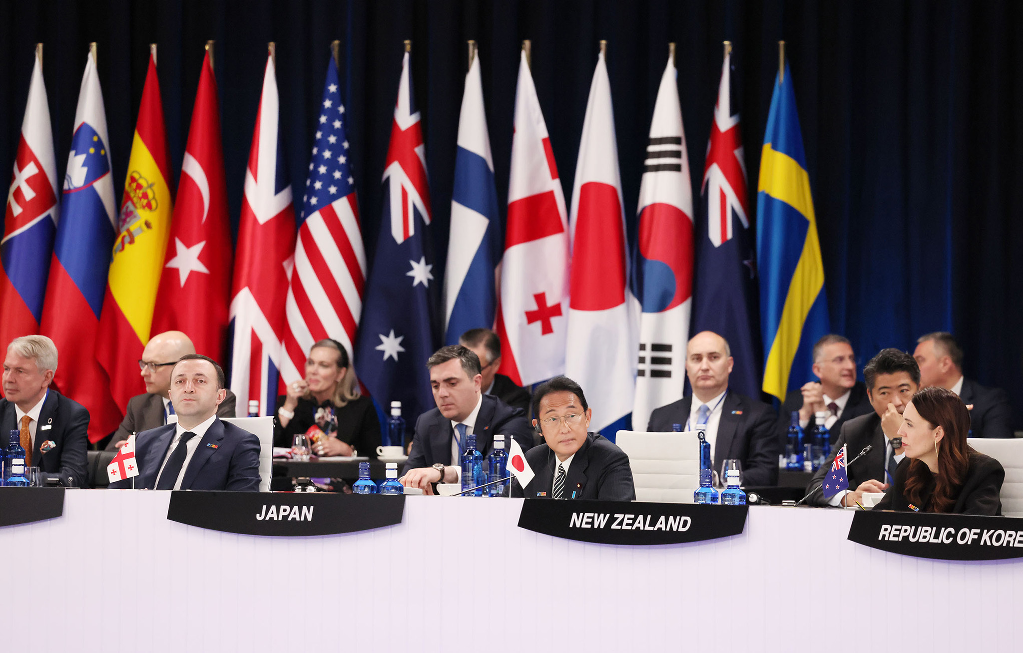 Japanese Prime Minister Fumio Kishida (center) and former New Zealand Prime Minister Jacinda Ardern (right) in Madrid, Spain, during the annual NATO summit, June 29, 2022. (Office of Japan’s Prime Minister)