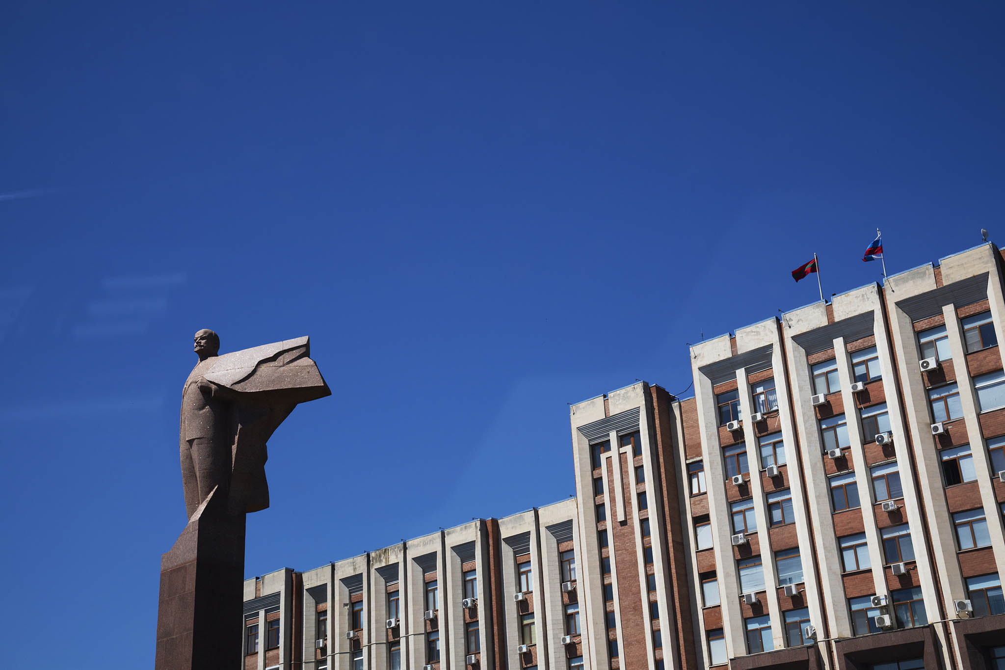 A statue of Lenin guards the parliament in Transnistria, a Russian-backed separatist enclave in Moldova. Russia uses Transnistria to pressure Moldova against joining the European Union as the Moldovan government plans. (Cristian Movila/The New York Times)