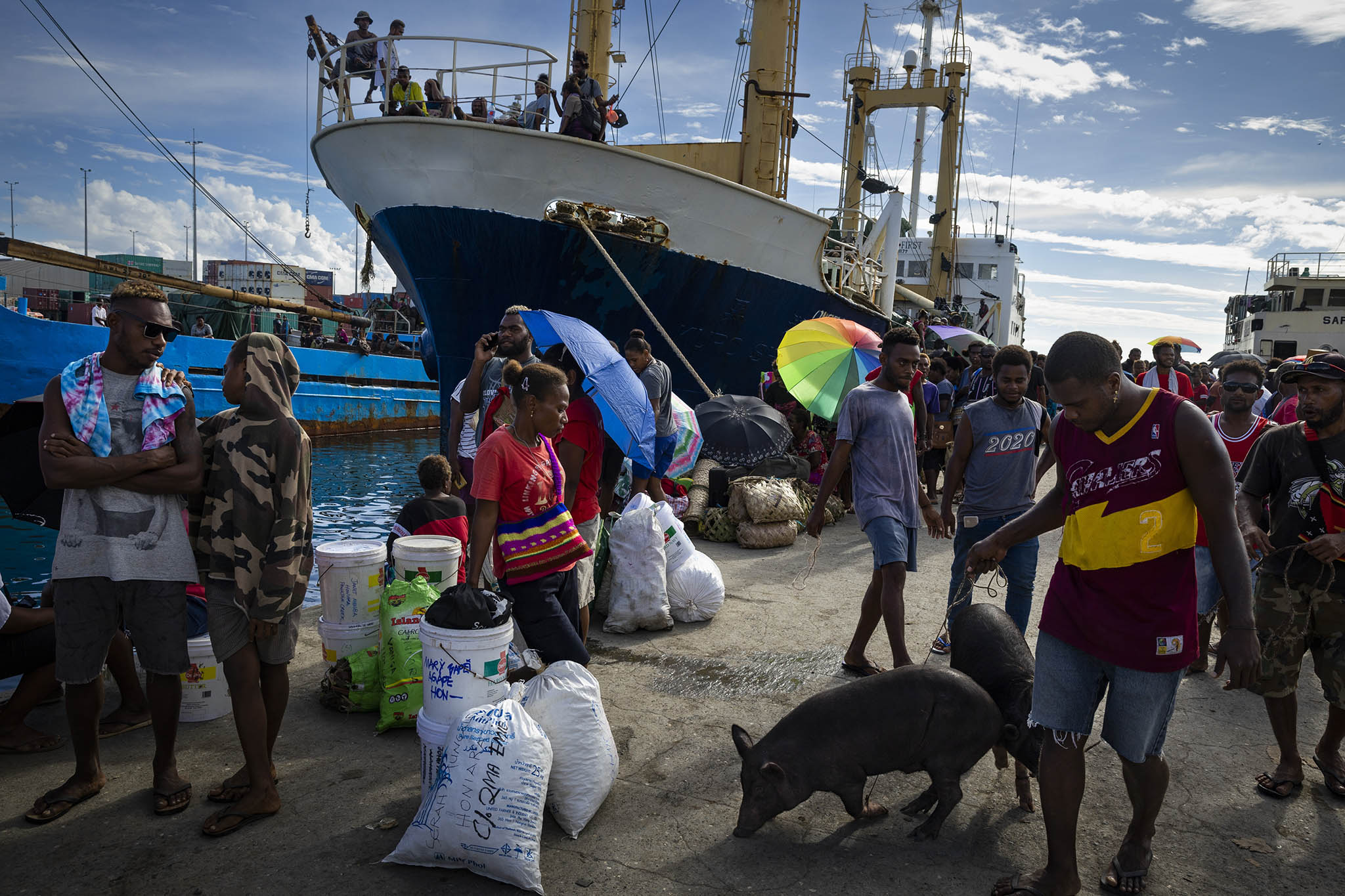 Passengers arrive at the port in Honiara, Solomon Islands, on Aug. 12, 2022. (Matthew Abbott/The New York Times)