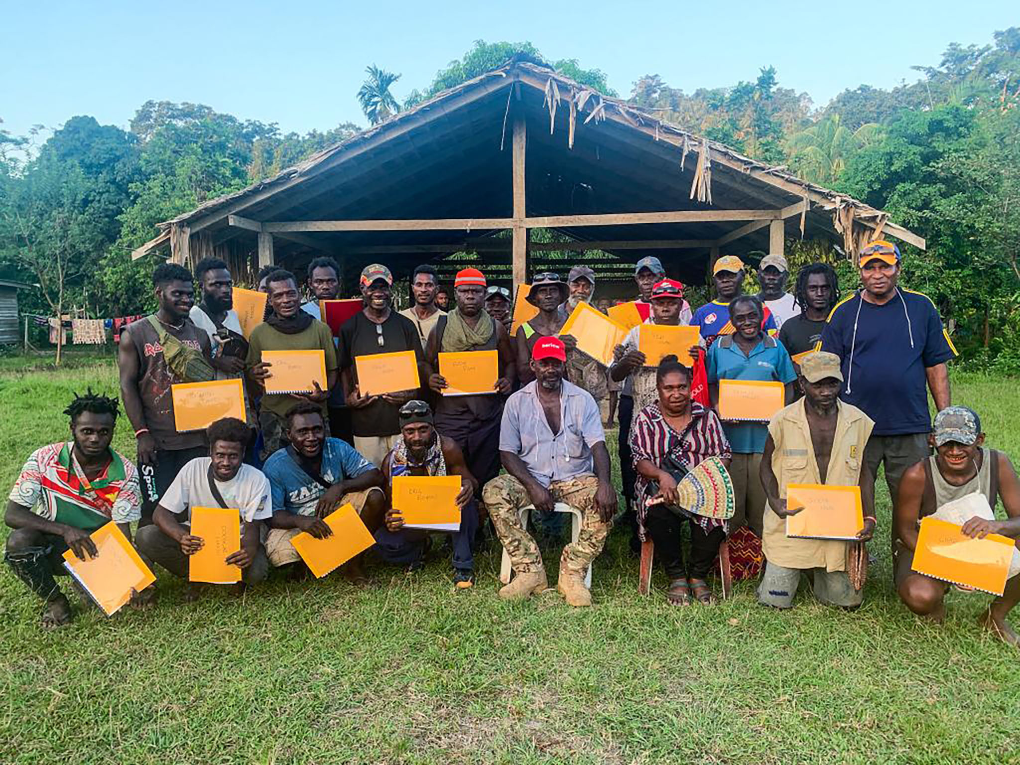 USIP’s Zuabe Tinning (front row, third from right) conducting a training for youth in the Autonomous Region of Bougainville.