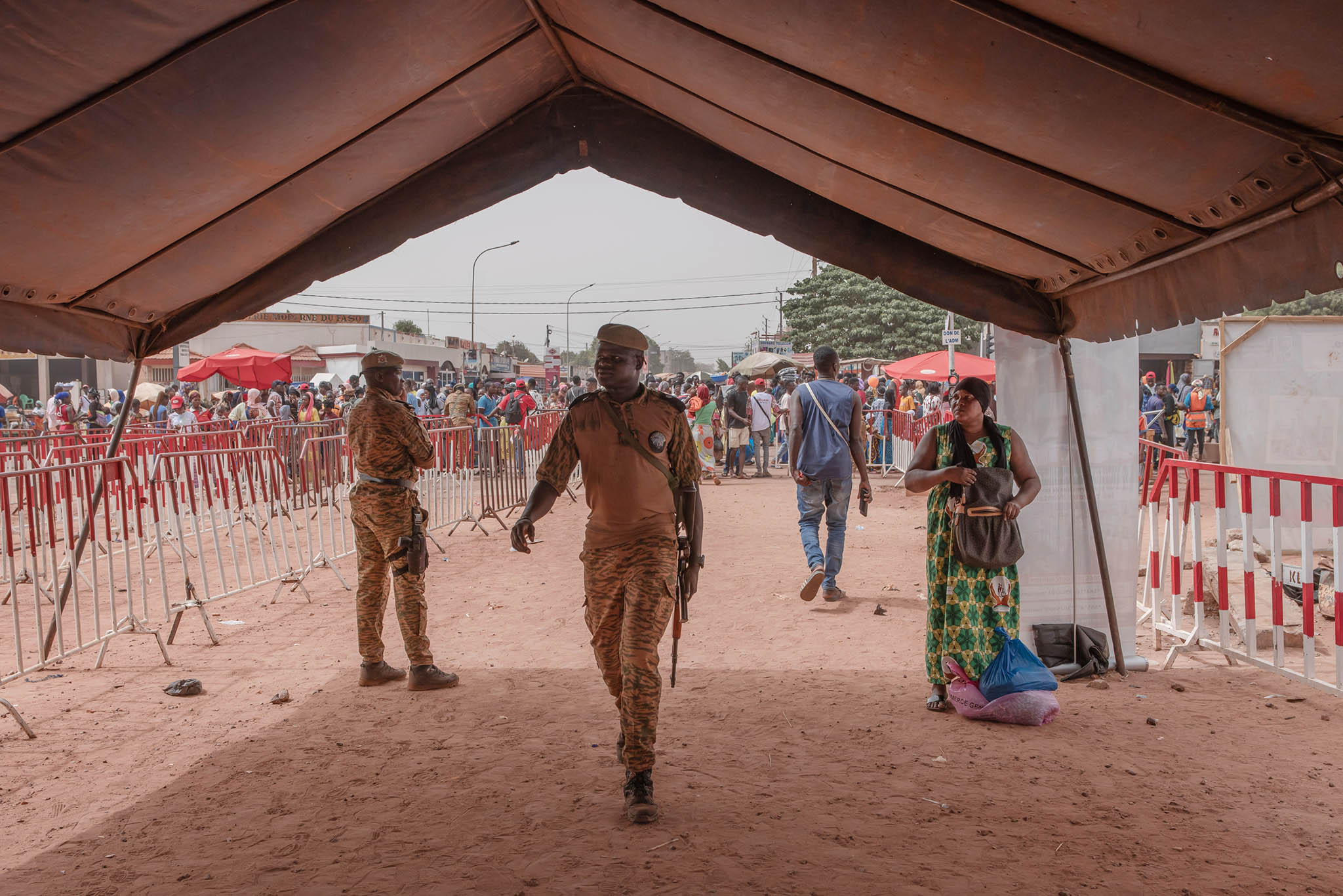 Security at a national cultural festival in Bobo-Dioulasso, Burkina Faso. one of only a handful of areas that remain relatively secure from violent extremists that have crept in from neighboring Mali, April 30, 2024. (Guerchom Ndebo/The New York Times)