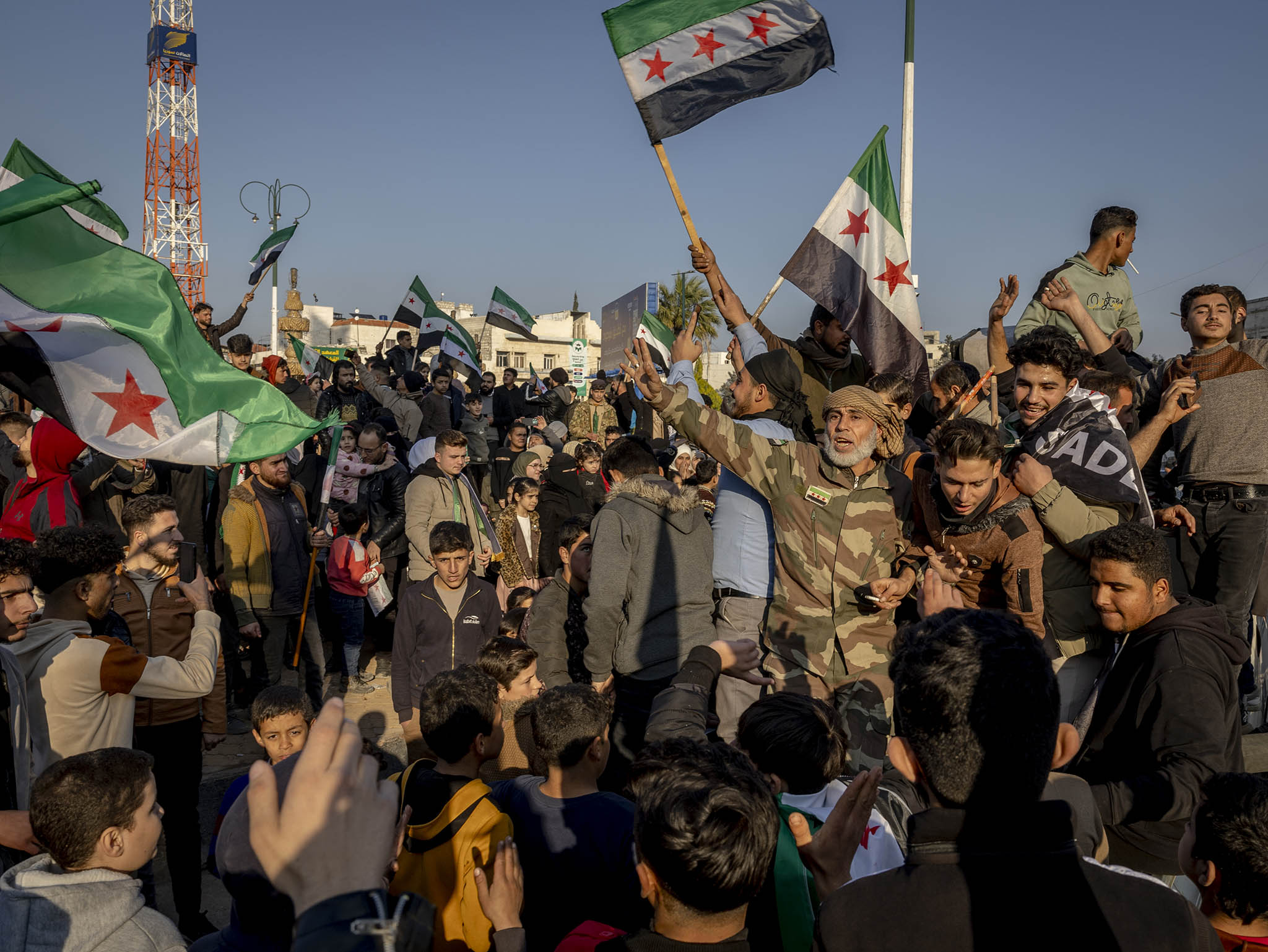 A large crowd celebrates the fall of the Assad government after Friday prayers in the center of Idlib, Syria, Dec. 13, 2024. (Ivor Prickett/The New York Times)