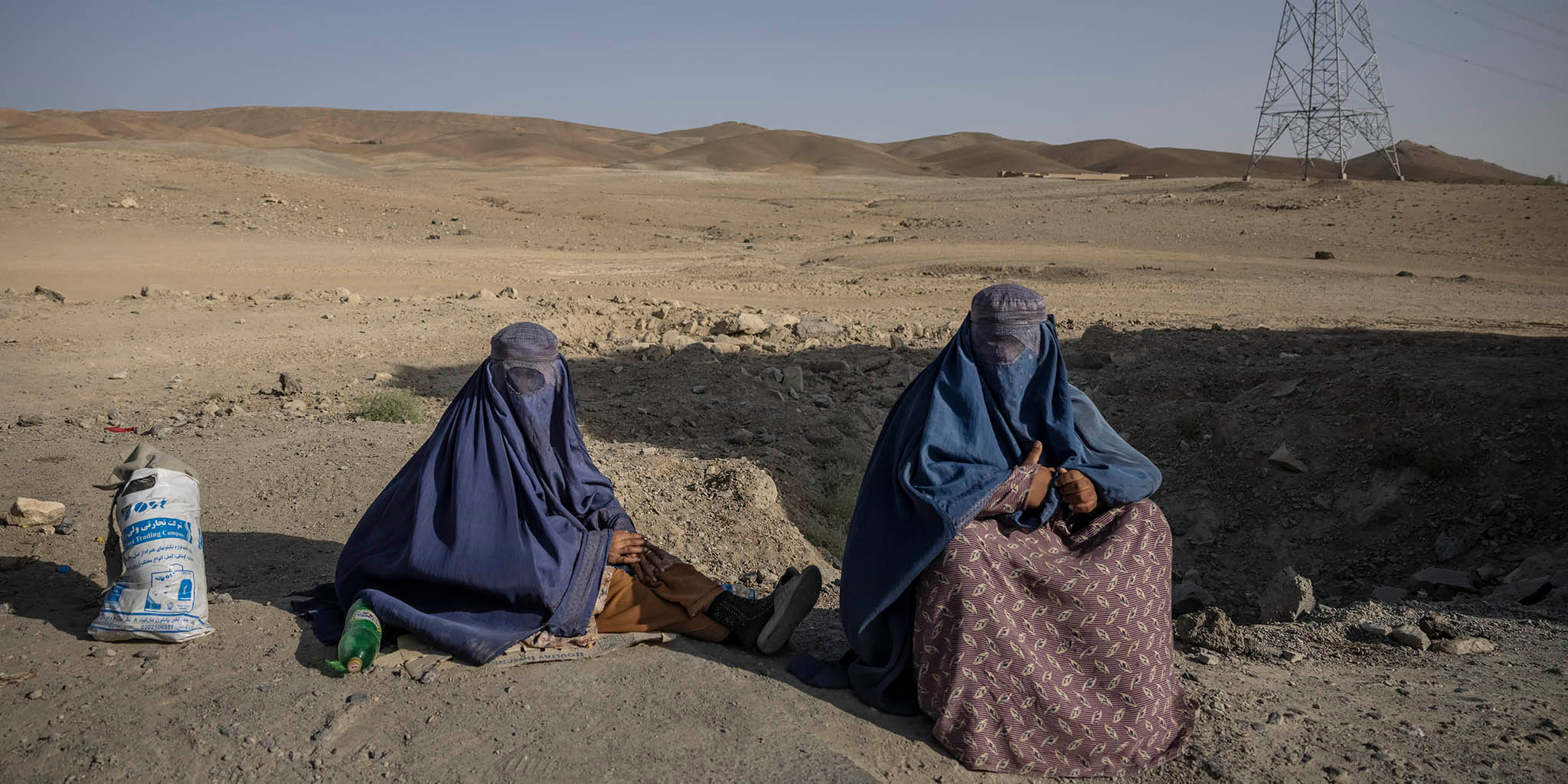 Women begging on the side of the road in Afghanistan's Ghazni province. September 22, 2021. (Victor J. Blue/The New York Times)