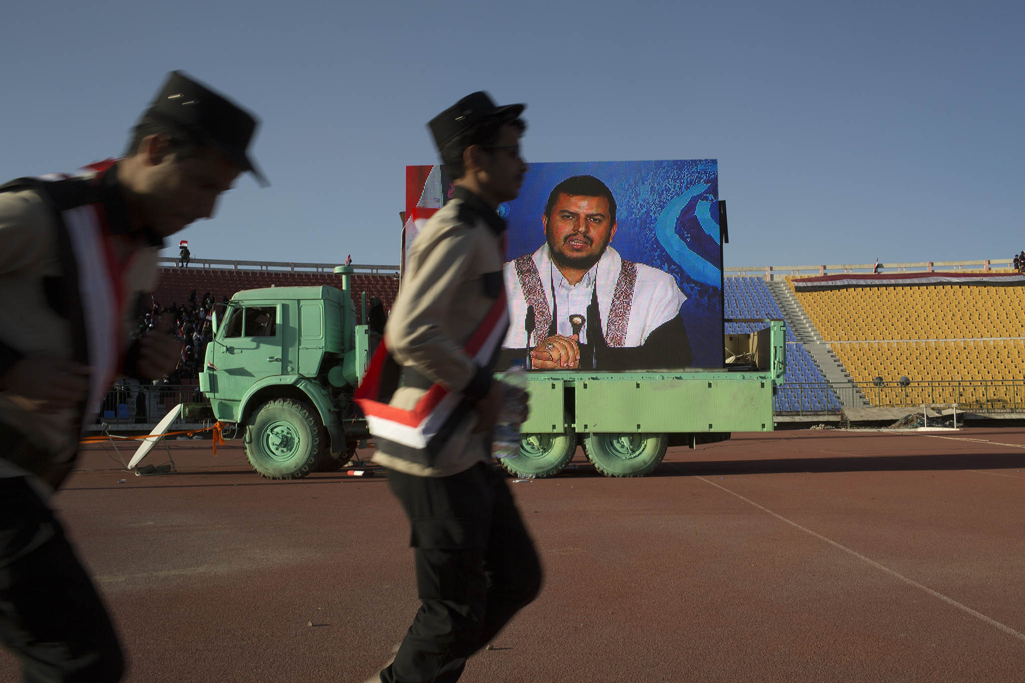 Abdul-Malik al-Houthi speaks via video link to supporters gathered at a stadium in Sanaa, Yemen, Feb. 7, 2015. (Tyler Hicks/The New York Times)
