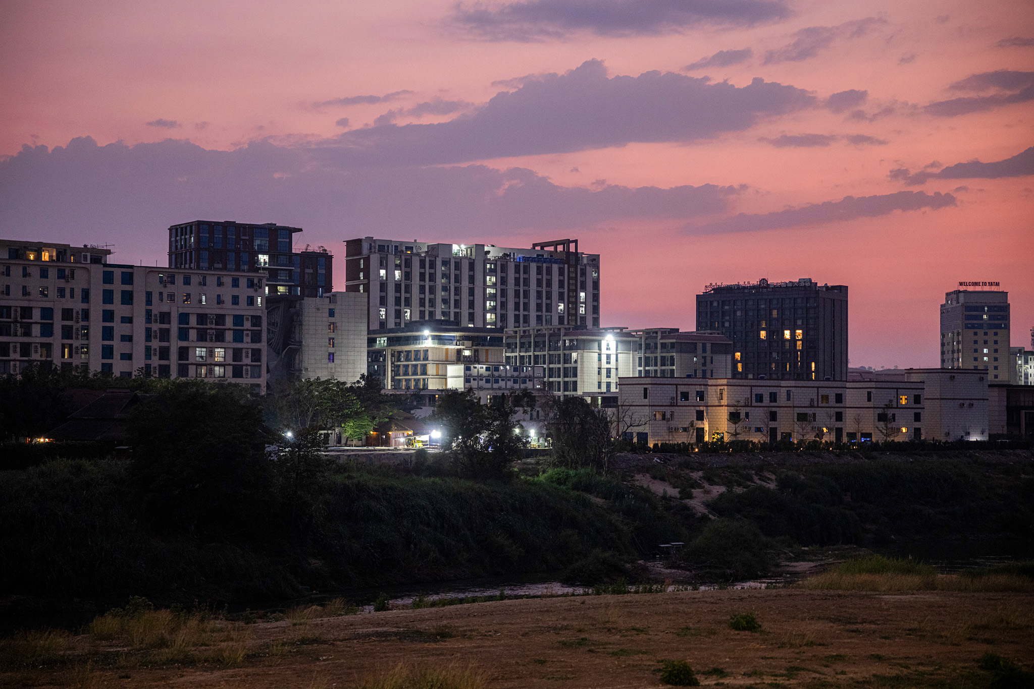 A notorious scam hub on the Myanmar side of the border, as seen from Tak, Thailand. February 21, 2025. (Lauren DeCicca/The New York Times)