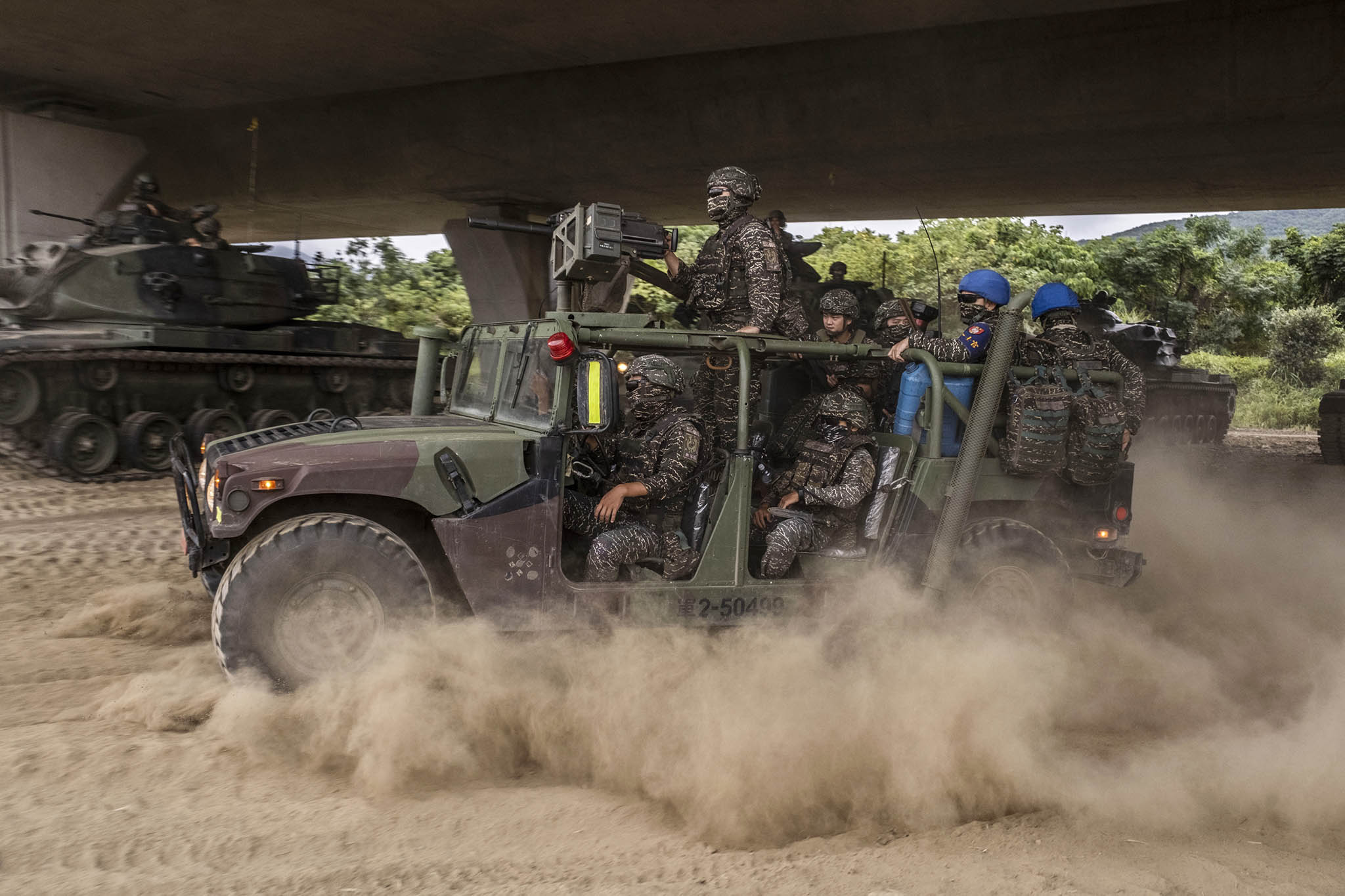 Taiwanese soldiers participate in a military exercise in the Bali District of Taiwan, July 27, 2023.. (Lam Yik Fei/The New York Times)