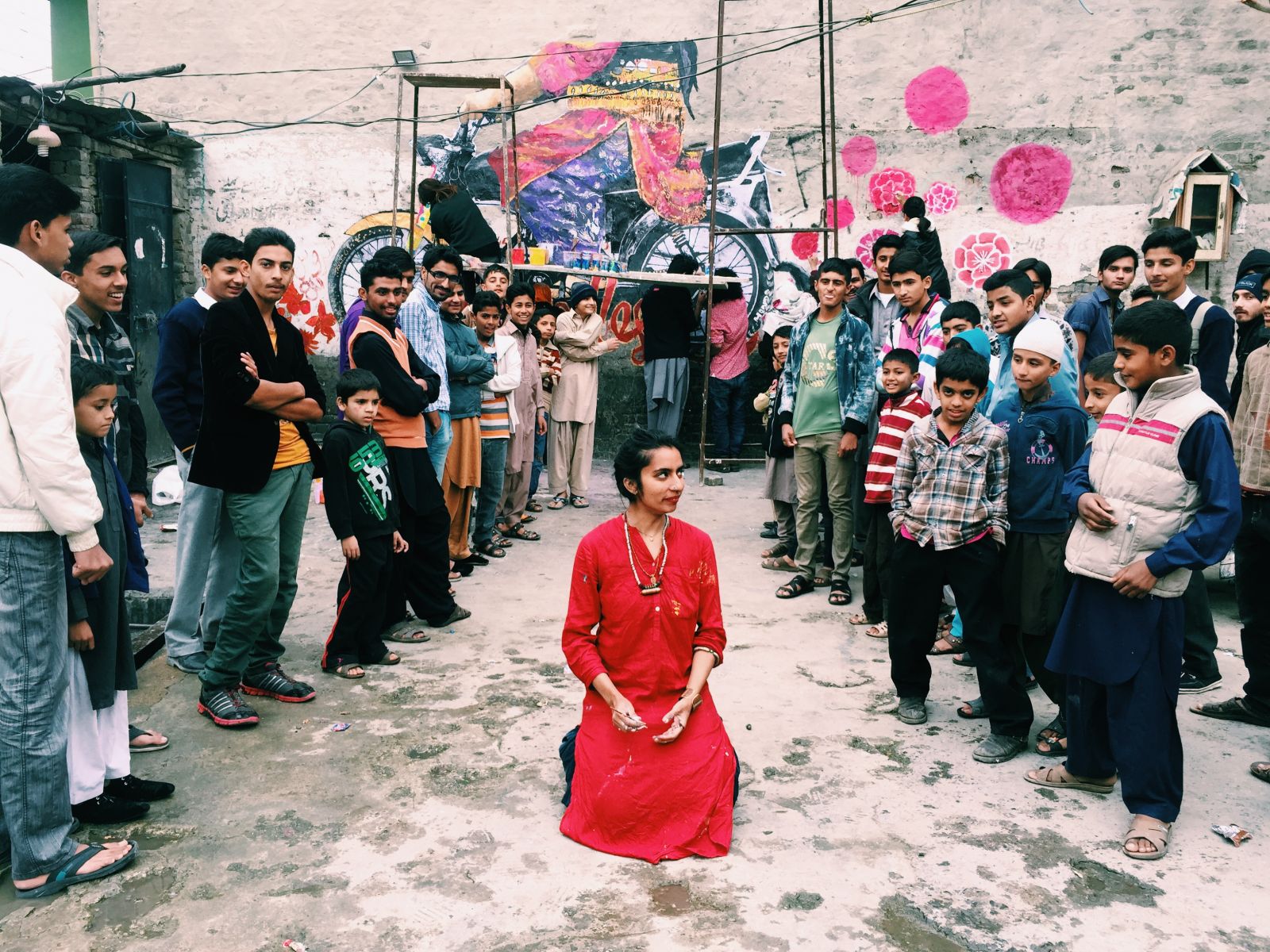 Shilo Shiv Suleman and local residents gather before Fearless Collective’s mural in Rawalpindi. Photo: Fearless Collective