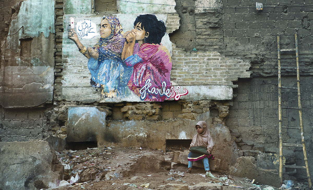 Fearless Collective’s painting on the crumbling wall of a street in Karachi’s Lyari Town. Photo: Fearless Collective