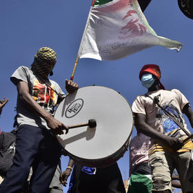 Sudanese youth rally last month in one of many protests, by tens of thousands of people, since October against Sudan’s army coup. Troops have quelled rallies by force, killing participants. (Faiz Abubakar Muhamed/The New York Times)
