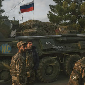 Armenian soldiers and a Russian peacekeeping soldier, on the vehicle, at a checkpoint in Nagorno-Karabakh. November 17, 2020. (Mauricio Lima/The New York Times)