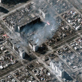 A March 21 photo shows damage and fires from Russian shelling of a residential area in Mariupol. Ukrainian officials say at least 80 percent of buildings have been hit in Russian attacks. (Satellite image ©2022 Maxar Technologies via The New York Times)