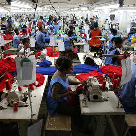 Ghanaians sew shirts for export at Dignity DTRT, a factory in Accra funded largely by U.S. investors. The firm trains and employs thousands of people in an economy whose growth is vital to sustaining Ghana’s 30-year democracy. (Dominic Chavez/World Bank)