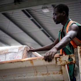 USAID kitchen kits are unloaded at a warehouse in Mozambique, April 2019. A U.S. plan to address conflict prioritizes Mozambique with a coordinated strategy among U.S. diplomacy, development and security agencies. (U.S. Air Force/Tech. Sgt. Chris Hibben)