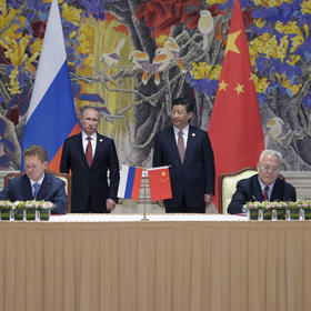 Russian President Vladimir Putin and Chinese Chinese Communist Party General Secretary Xi Jinping stand during the signing of a gas deal in Shanghai, May 21, 2014. (Alexei Druzhinin/RIA Novosti/Pool via The New York Times)