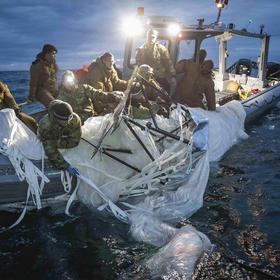 U.S. Navy shows sailors recovering a high-altitude Chinese surveillance balloon off the coast of Myrtle Beach, S.C. on Feb. 5, 2023. (Tyler Thompson/U.S. Navy via The New York Times)