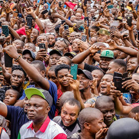 Nigerians in Lagos cheer and snap photos at a February rally for presidential candidate Peter Obi in a three-way race. Obi and rival candidate Atiku Abubakar are challenging the election’s declared outcome in court. (Taiwo Aina/The New York Times)