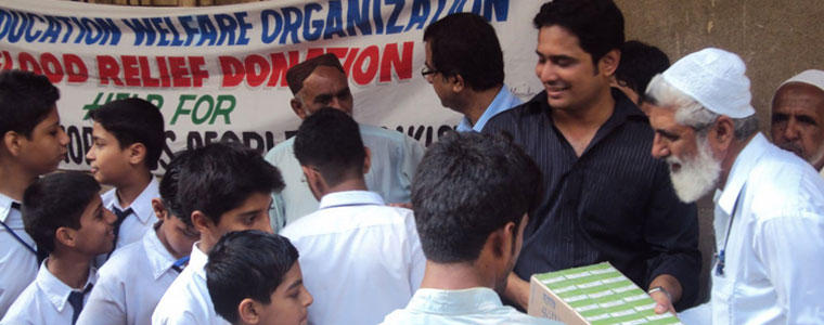 Nadeem Ghazi with students providing relief supplies to flood victims in Pakistan.