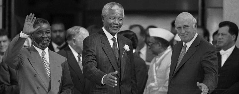 President Nelson Mandela is flanked by Deputy Presidents Thabo Mbeki, left, and F.W. de Klerk following their inauguration in Pretoria, South Africa, on May 9, 1994. Photo Credit: New York Times/Ozier Muhammad