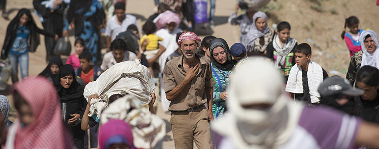 Refugees leave Syria at the border checkpoint in Dahuk, Iraq. Photo Credit: The New York Times/ Lynsey Addario