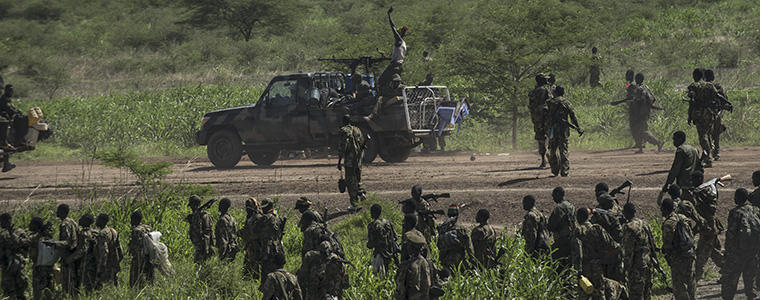 Government soldiers with the Sudanese Peoples Liberation Army march towards the town of Bentiu in South Sudan, May 4, 2014. Government forces went on the offensive and took back the oil hub of Bentiu from rebels loyal to Riek Machar. (Lynsey Addario/The New York Times) 