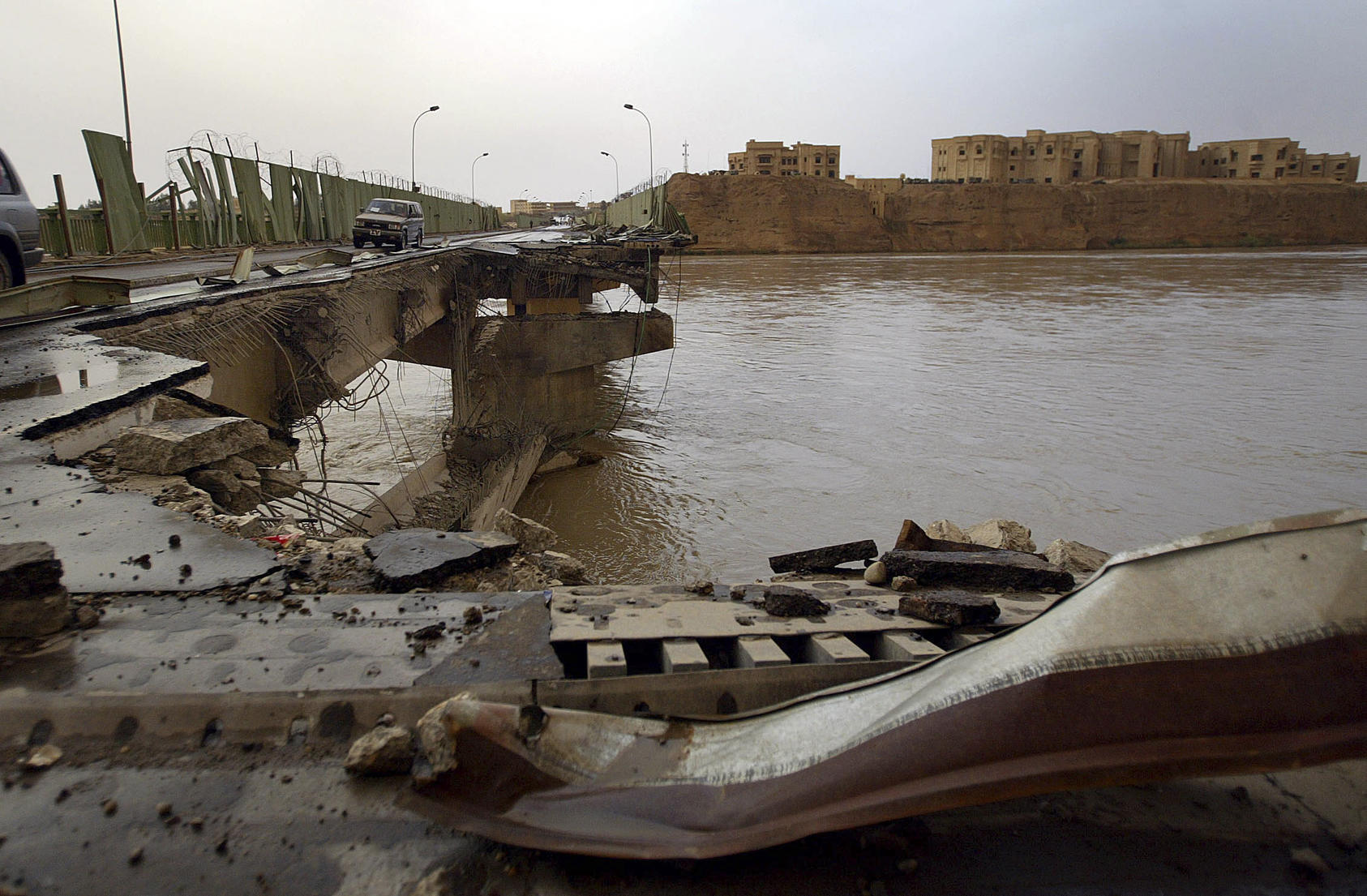 A bridge bombed by American forces, and a palace of Saddam Hussein's, right, in Tikrit, Iraq, April 15, 2003. Tikrit fell to ISIS insurgents on June 11, 2014, clearing a path for them to march on to Baiji, home to one of Iraq’s foremost oil-refining operations. After taking the city in less than a day, militants continued the fight just south, in Samarra. (Chang W. Lee/The New York Times) 