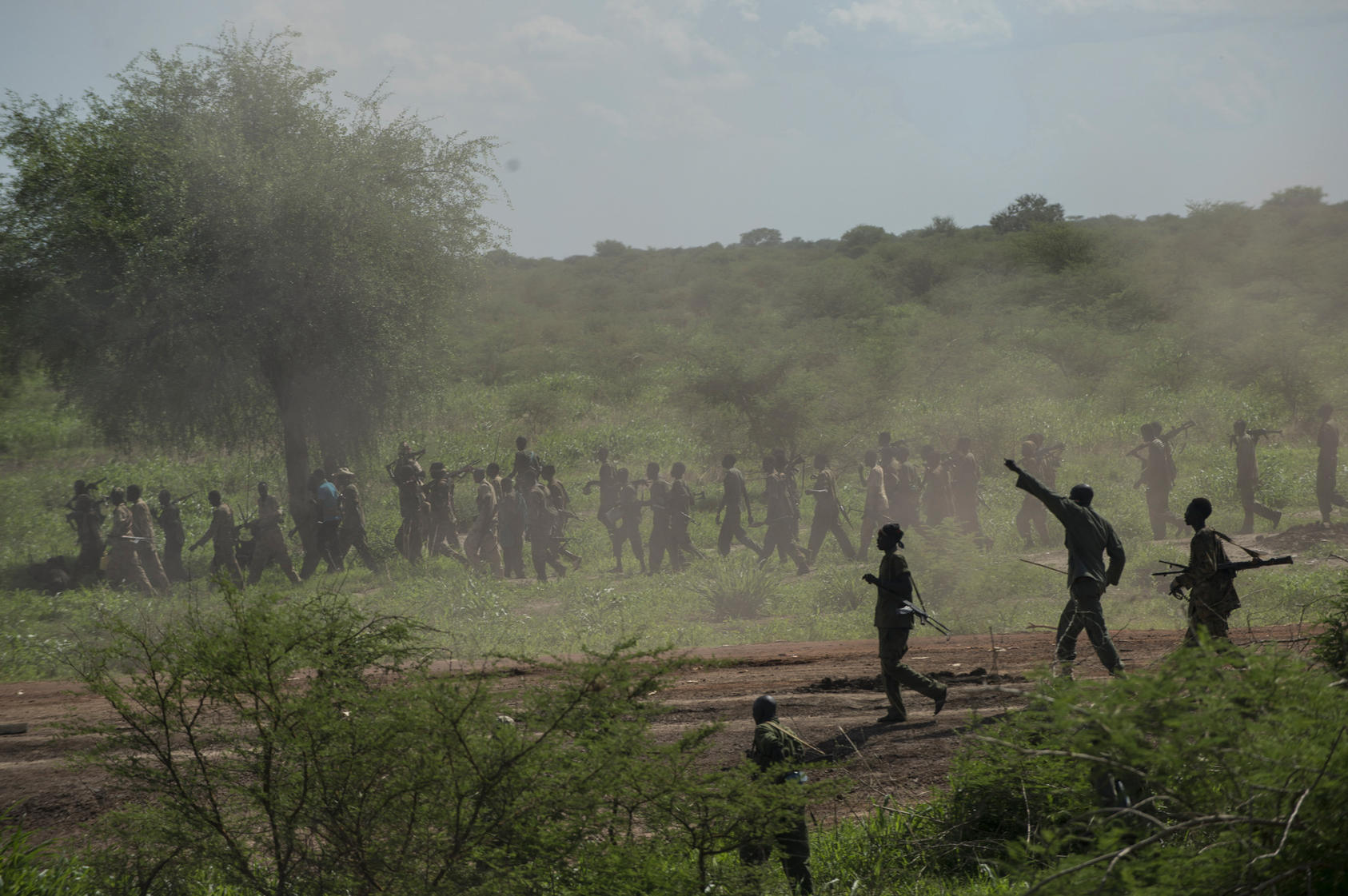 Government soldiers with the Sudanese Peoples Liberation Army march towards the town of Bentiu in South Sudan.