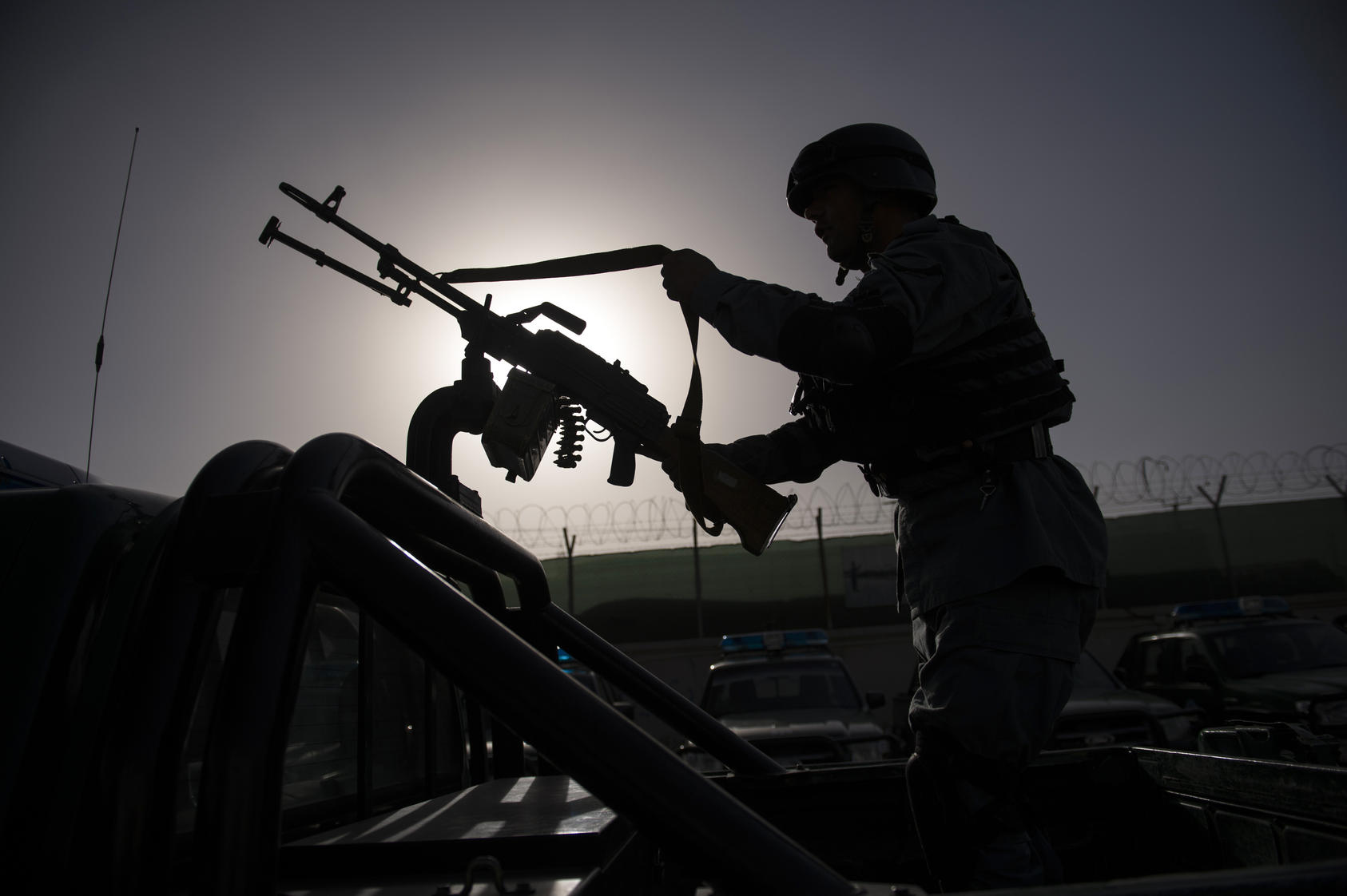 A police officer prepares for a patrol in Kabul, Afghanistan