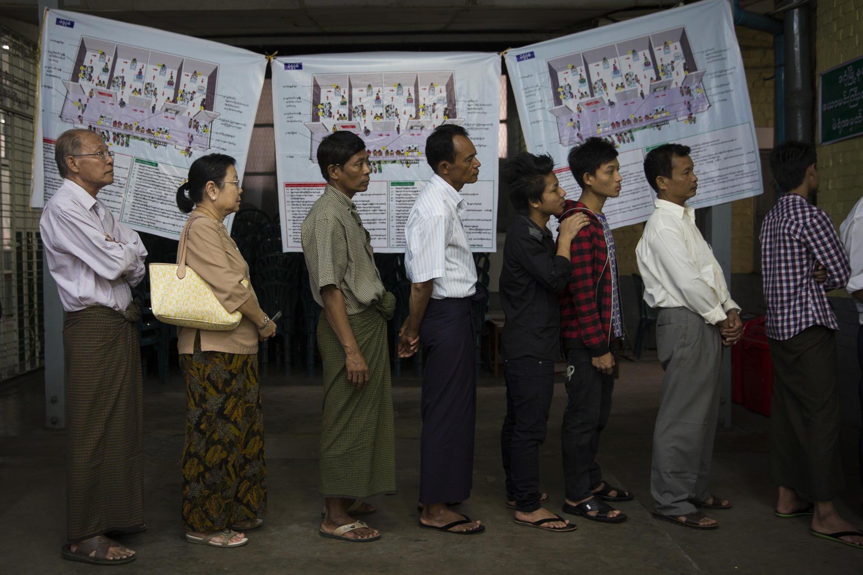 Voters line up at a polling station in Dagon High School in the Dagon township of Yangon, Myanmar, Nov. 8, 2015. The opposition party of the Nobel Peace laureate Aung San Suu Kyi said Monday that it was confident of a sweeping victory in the country’s landmark nationwide elections, while the ruling military-backed party acknowledged its poor showing. 