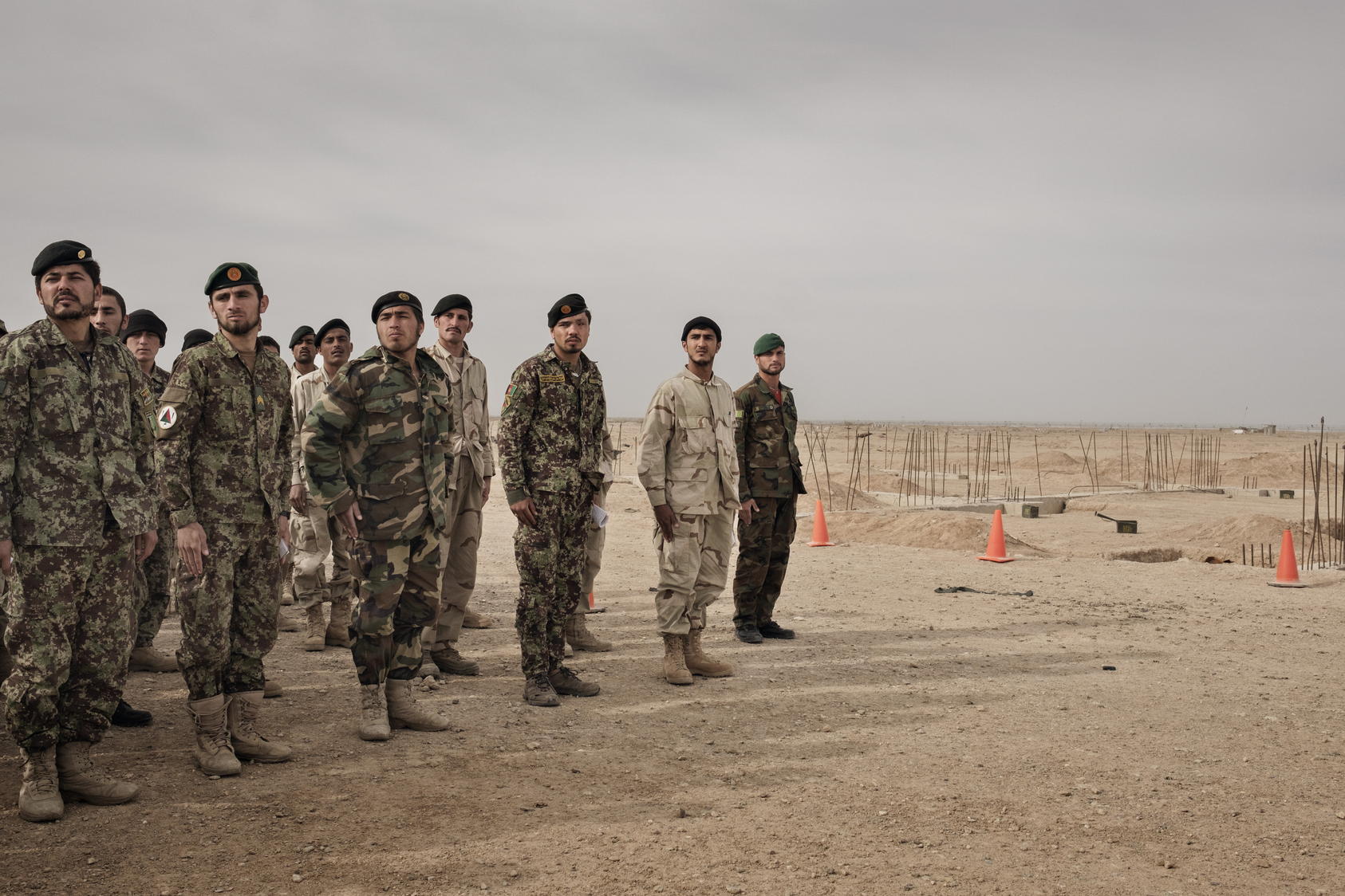 Members of the Afghan Army stand in formation during training, overseen by U.S. Army soldiers at Camp Bastion in Helmand Province, Afghanistan, March 22, 2016. President Barack Obama inched closer recently to allowing American forces to once again directly battle the Taliban, loosening restrictions on airstrikes and on ground combat in support of Afghan forces, the administration said on June 10.