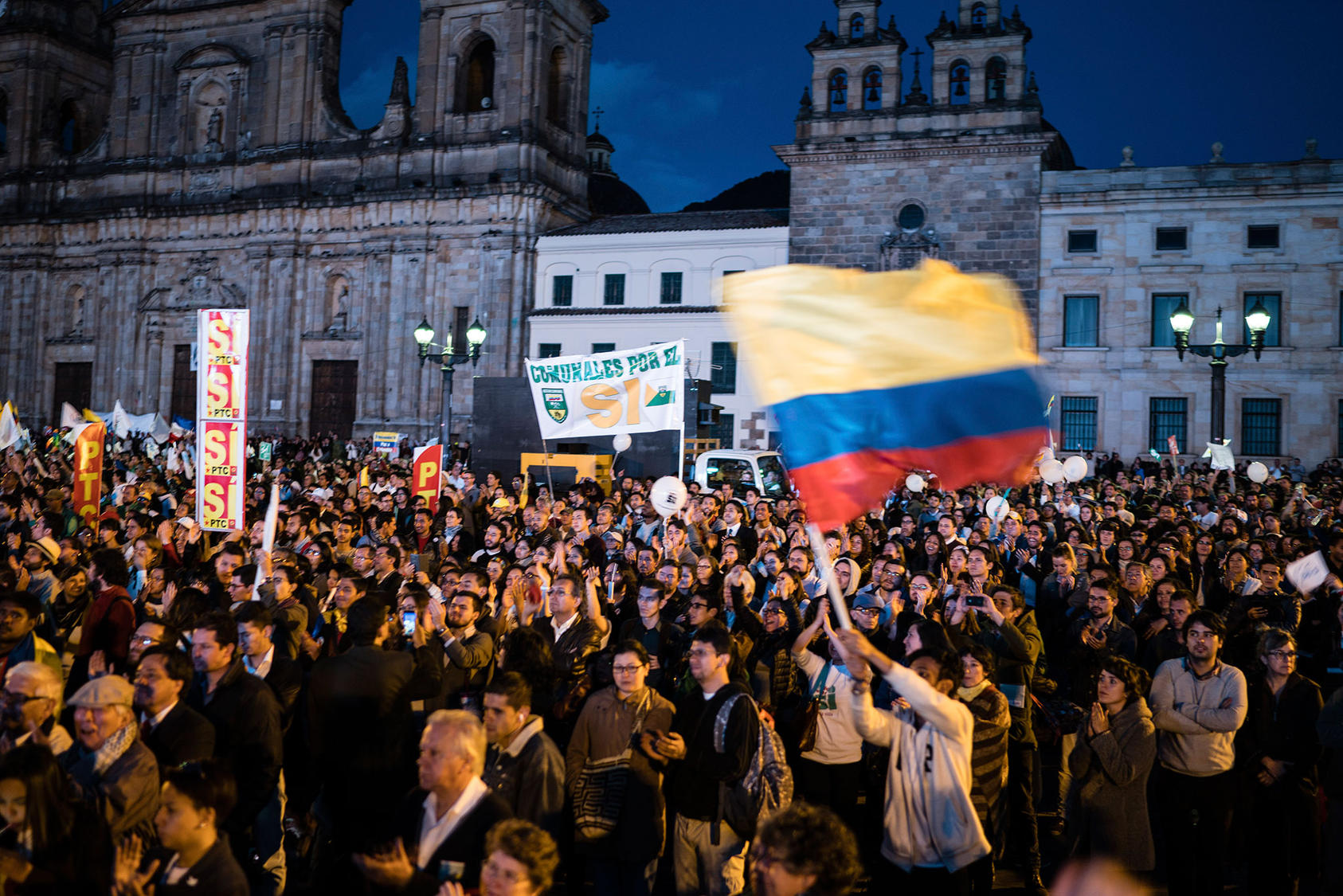 People celebrate the signing of a peace agreement between the Colombian government and the Revolutionary Armed Forces of Colombia, or FARC, in Bogota