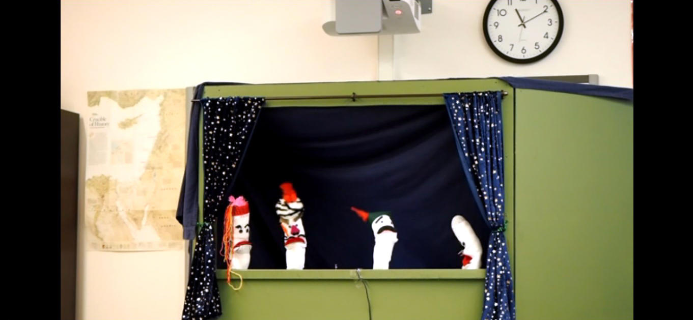 Timothy McMahon’s students present a puppet show mediation between Loyalists and Patriots. 
