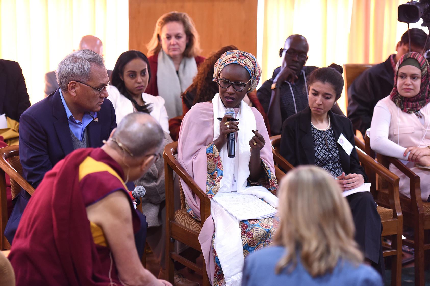 Fatima Askira poses a question of His Holiness the Dalai Lama