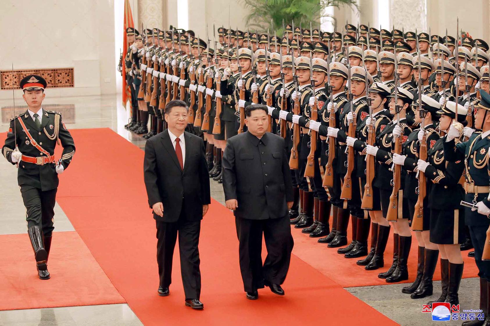 President Xi Jinping of China, left, and Kim Jong-un, North Korea’s enigmatic young leader, inspect an honor guard during a ceremony at the Great Hall of the People in Beijing on March 26, 2018. (Korean Central News Agency via The New York Times)