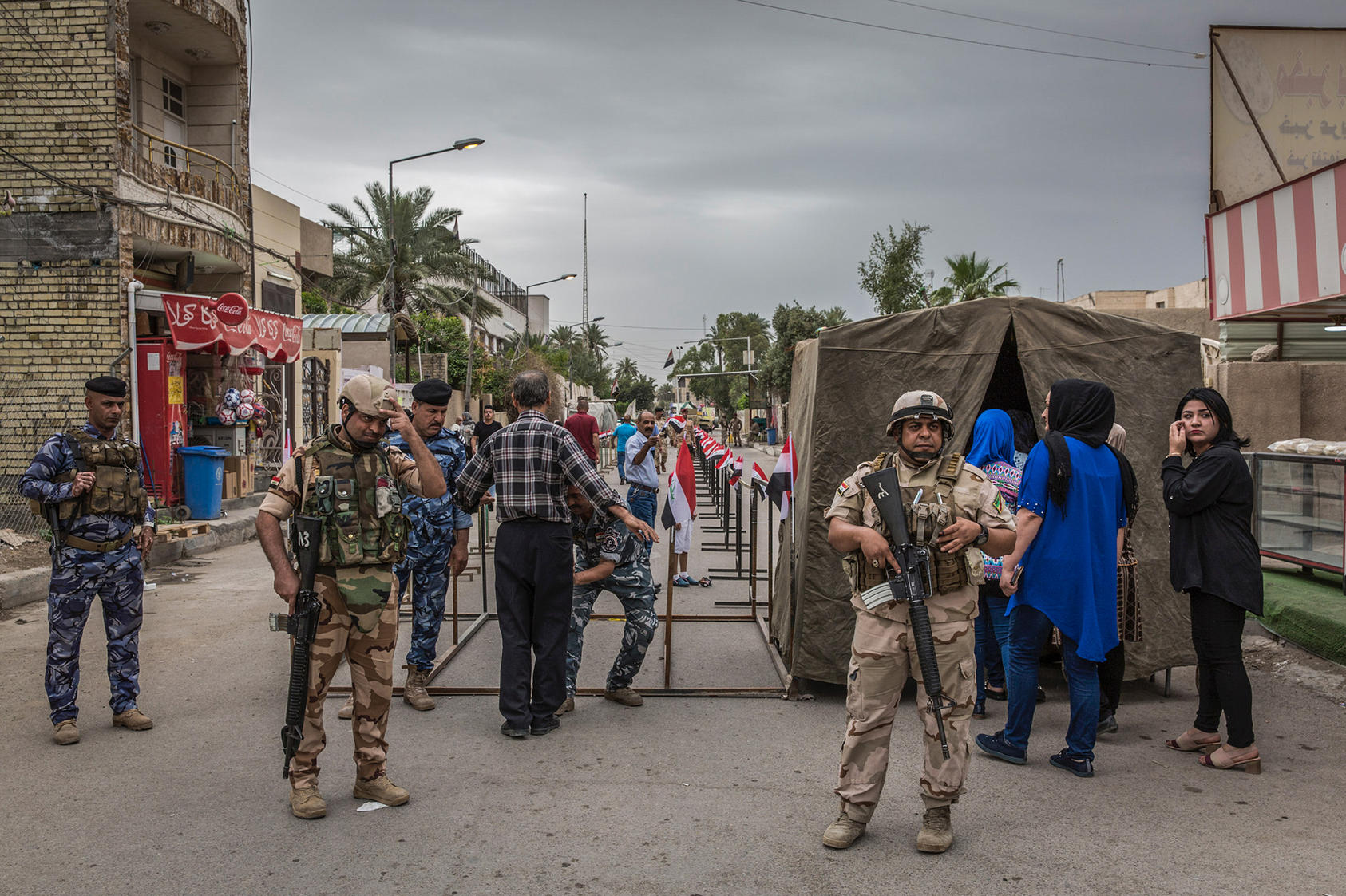 Soldiers stand guard at a polling place during Iraq's national elections, in Baghdad, May 12, 2018. (Ivor Prickett/The New York Times)