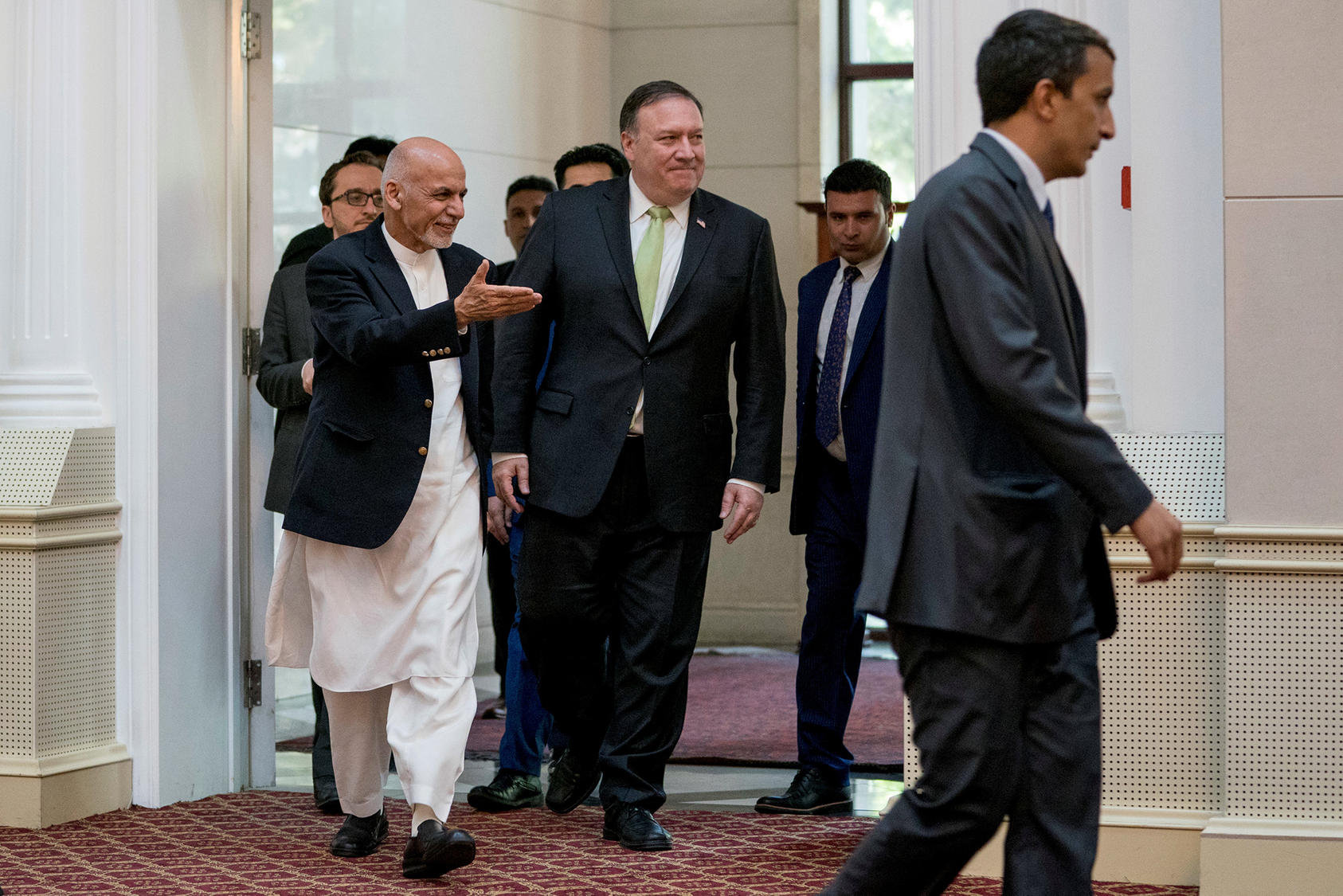 Afghan President Ashraf Ghani, left, accompanied by U.S. Secretary of State Mike Pompeo, at the presidential palace in Kabul, Afghanistan, July 9, 2018.