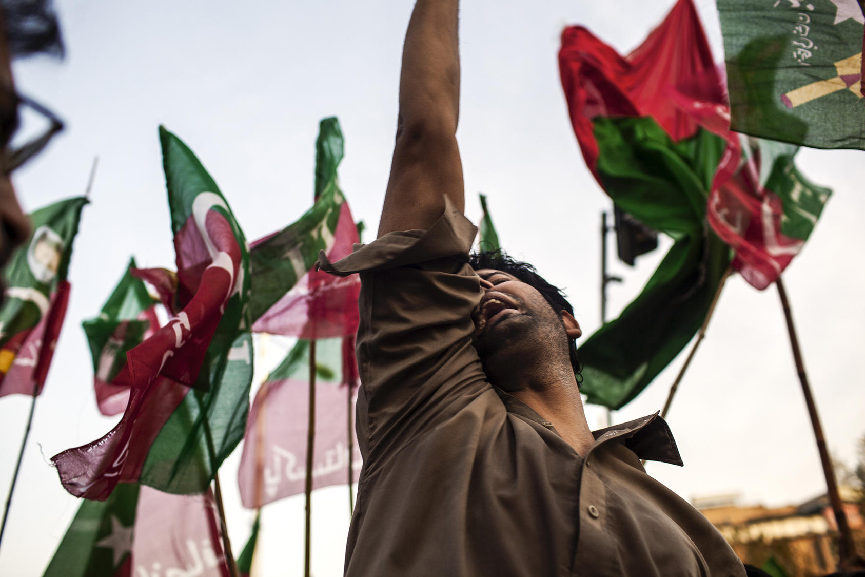 A supporter of the Pakistan Tehreek-e-Insaf (PTI) party of former cricket star Imran Khan demonstrates in Islamabad, Pakistan.