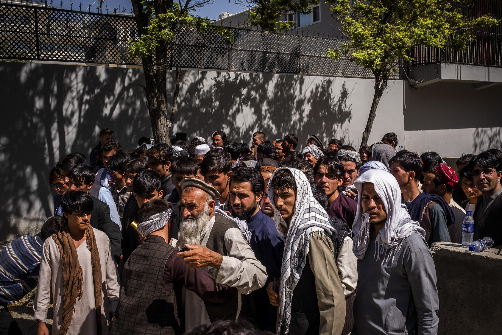 Attendees are searched before entering a political rally in Kabul. Voting under threat of Taliban violence, Afghans across the country cast ballots for parliament on October 20. (Jim Huylebroek/The New York Times)