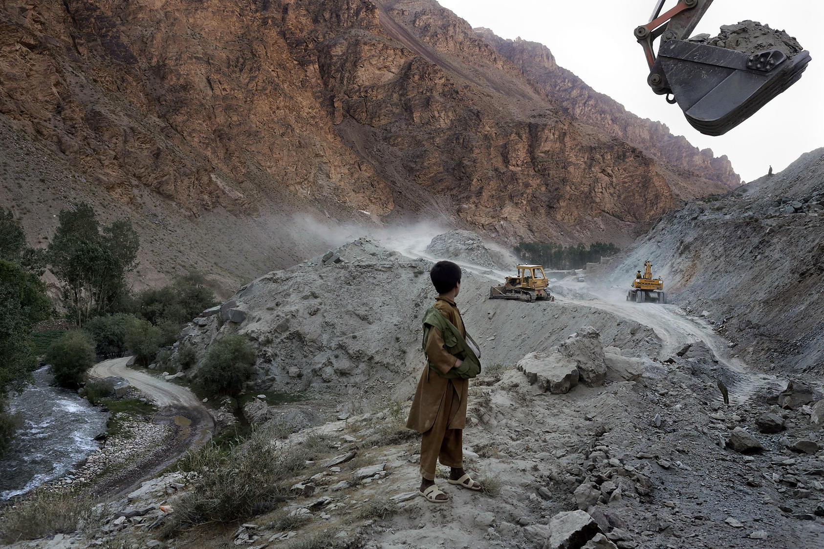 Above road construction near an iron ore mine near Bamiyan, Afghanistan, July 4, 2012. The country’s lack of infrastructure has hindered efforts to exploit its natural resources. (Mauricio Lima/The New York Times)