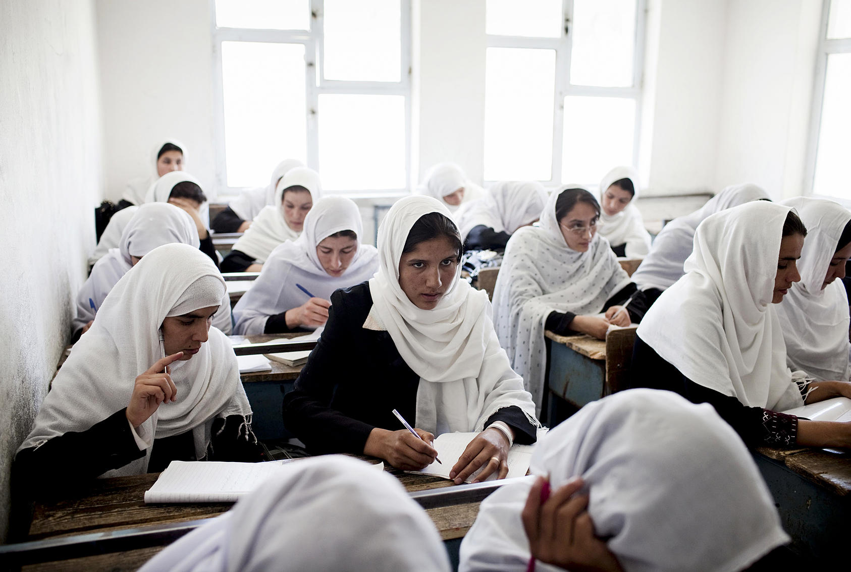 Female Afghan students at the Jamal Agha Girls School in Kapisa province, Afghanistan. Women’s education has been one of the biggest success stories post-2001, but many fear these gains could be sacrificed for peace. (Adam Ferguson/The New York Times)