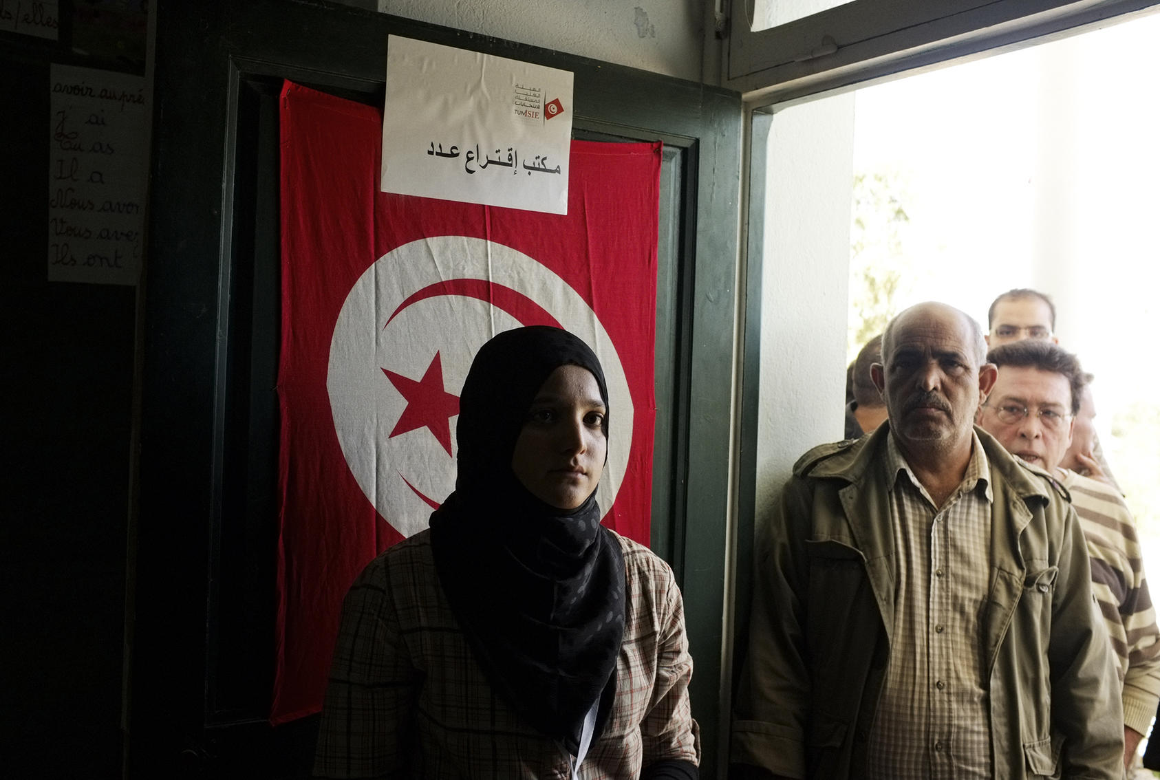 Voters wait their turn to cast their ballots at a polling site in a school in Tunis, Tunisia, on Oct. 23, 2011. (Moises Saman/The New York Times) 
