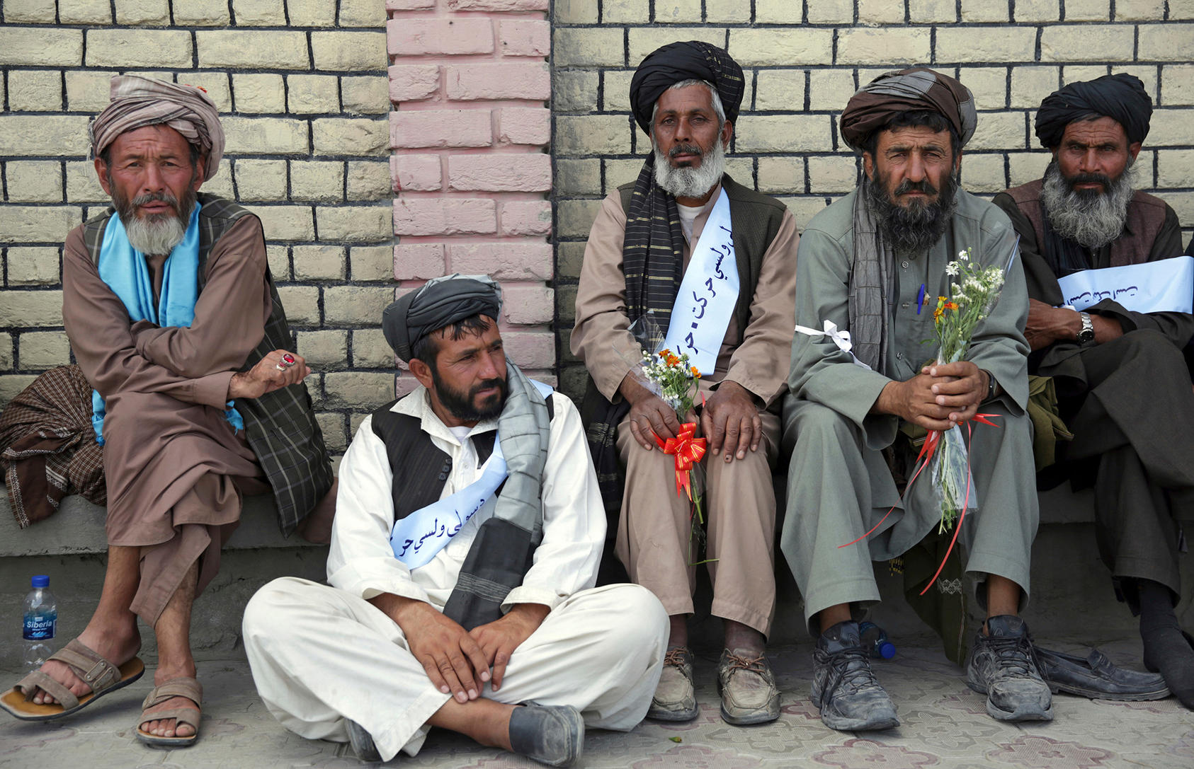 Members of the Helmand Peace Convoy rest in Kabul after marching more than three hundred miles from Lashkar Gah to protest the war. (Photo by Massoud Hossaini/ AP/ Shutterstock)