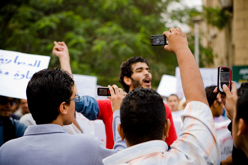 Video recording by mobile phones  Police troops surrounded Cairo University, as hundreds of students demonstrated against the rising education fees.