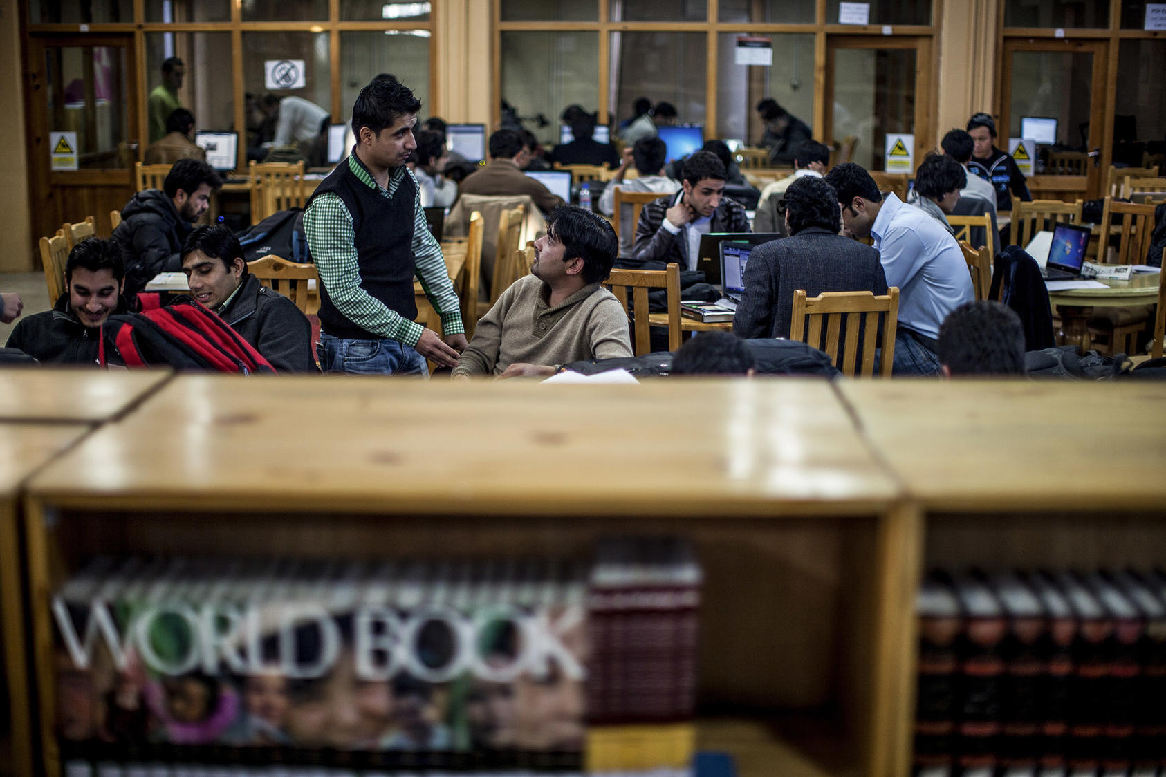 Students at the American University of Afghanistan study in the library in Kabul, Afghanistan. (Bryan Denton/The New York Times)