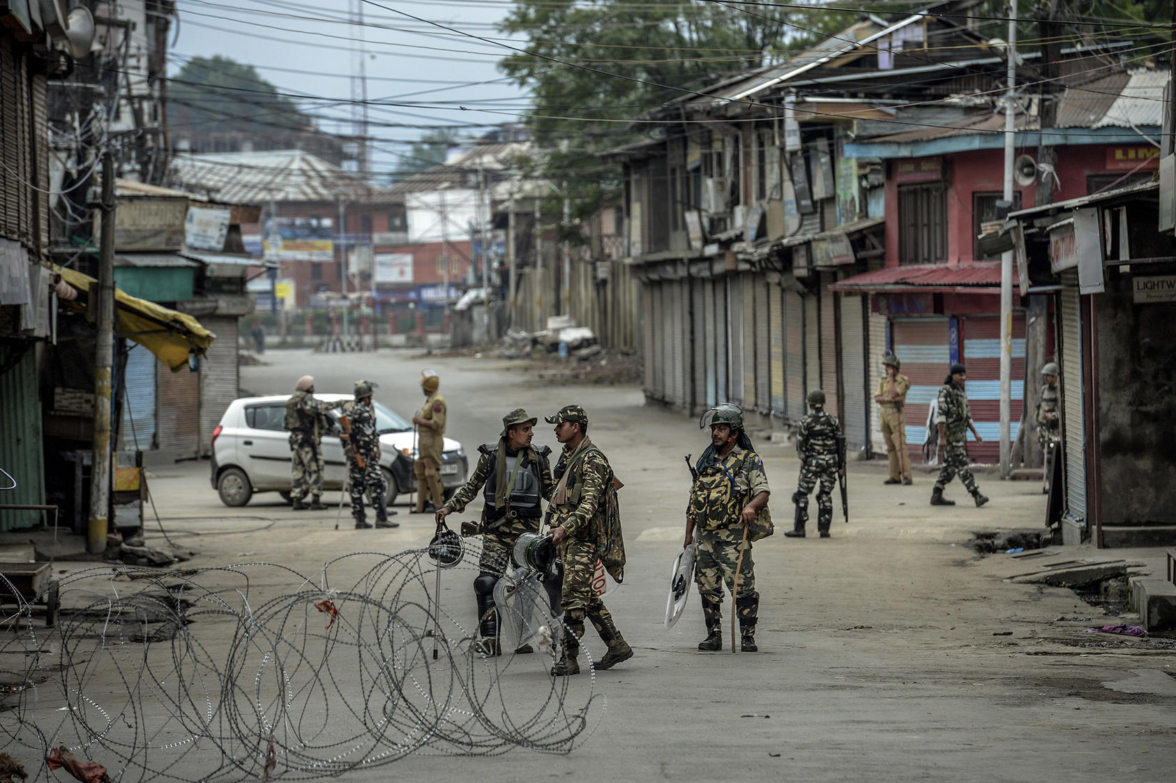 Barbed-wire placed by security personnel stretches across a Srinagar street in Indian-controlled Kashmir, Aug. 11, 2019.
