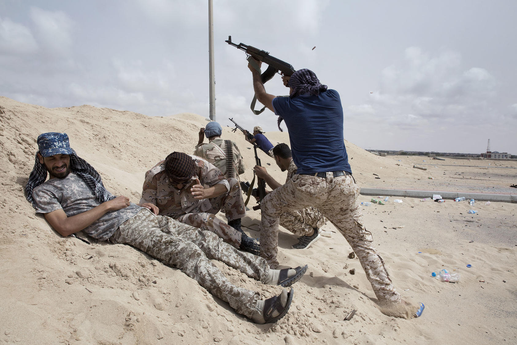 Fighters loyal to the U.N.-backed government battle ISIS in Sirte, Libya, June 23, 2016. Although ousted from Sirte, a security vacuum in the south could lead to the reemergence of ISIS. (Tyler Hicks/The New York Times)
