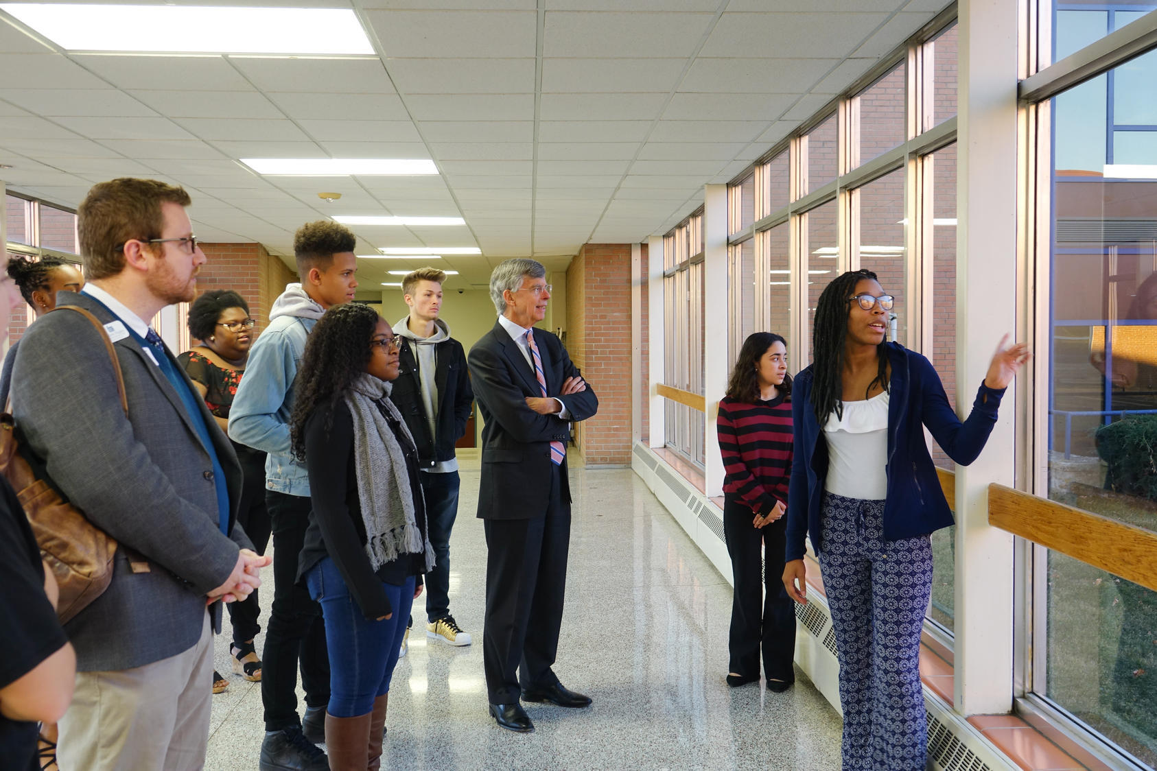 Students of Peace Teacher Amy Cameron providing USIP Executive Vice President William Taylor with a tour of their high school