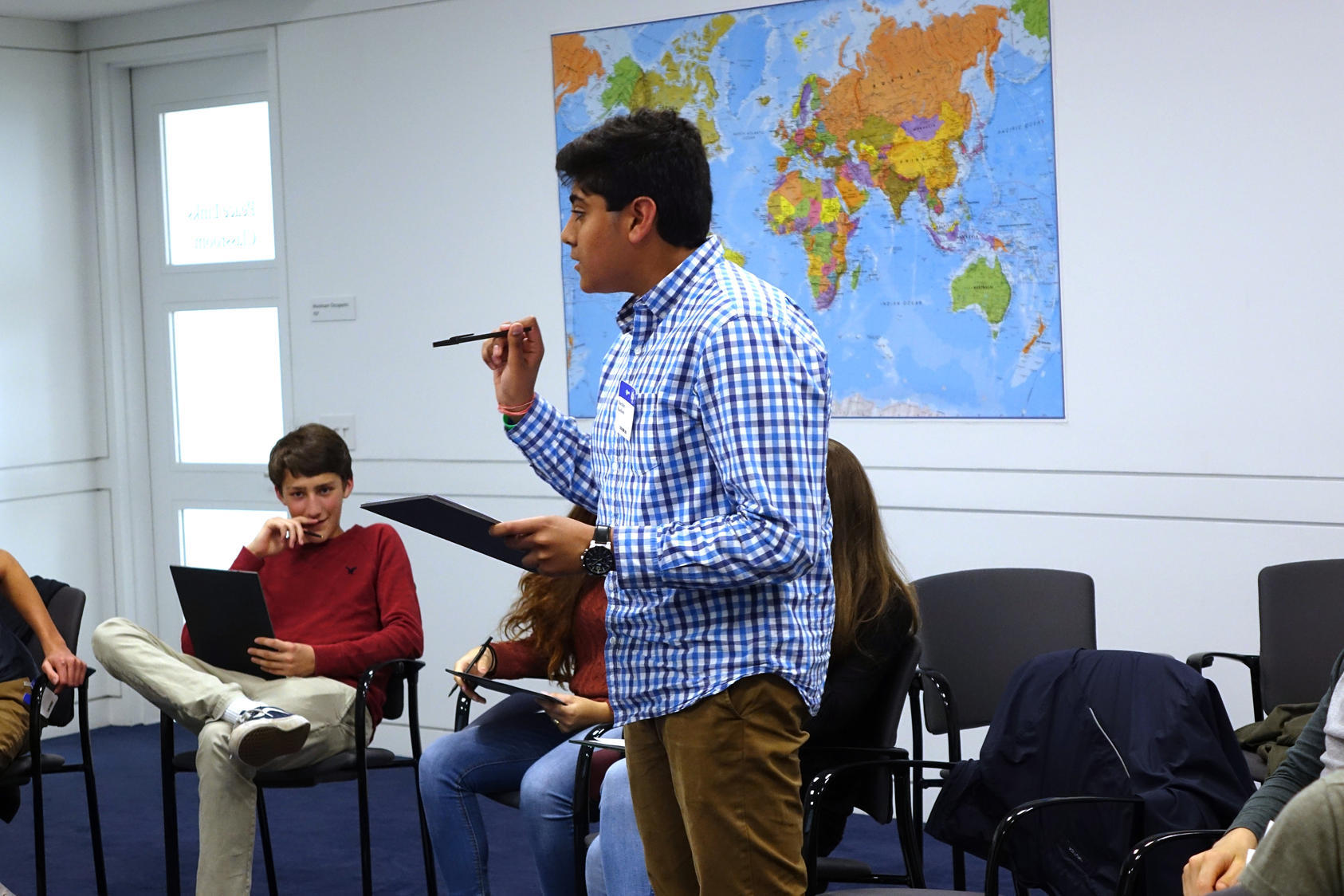 A student from Atlanta International School engaging his fellow classmates during a mediation simulation at USIP.